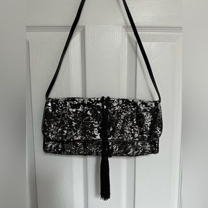 White House Black Market black and silver sequins clutch with removable strap.
